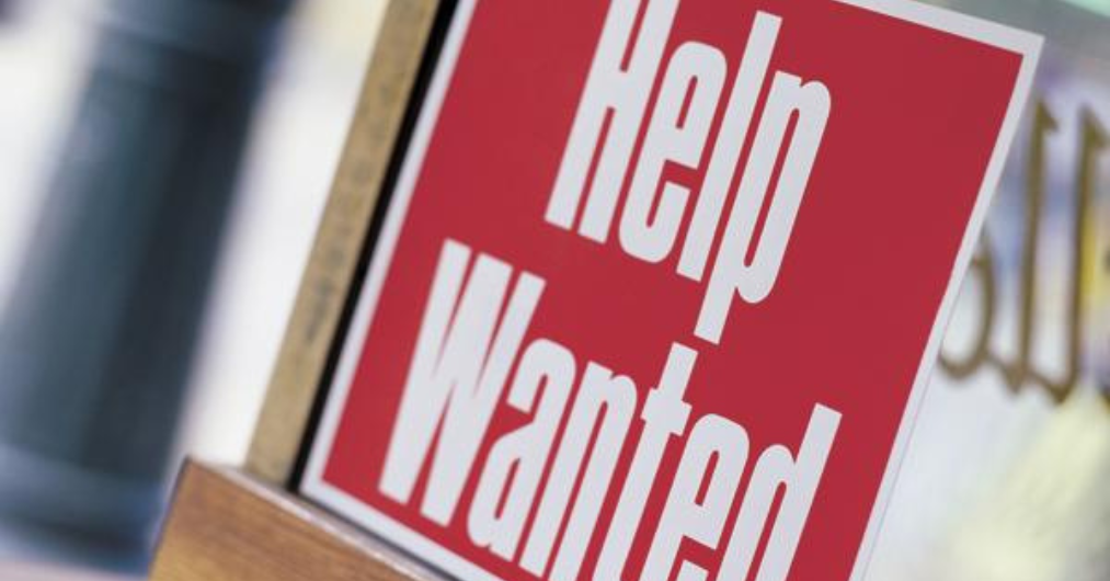 Help Wanted sign on a business door