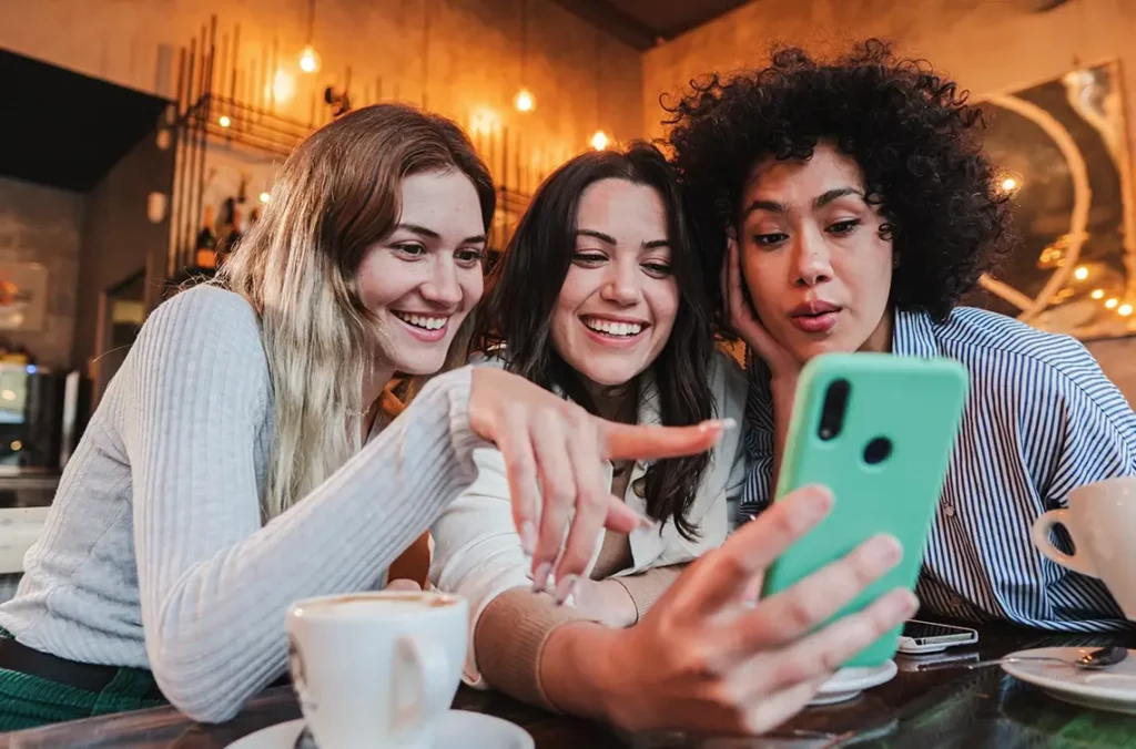 3 women place an order via a text message ordering system.